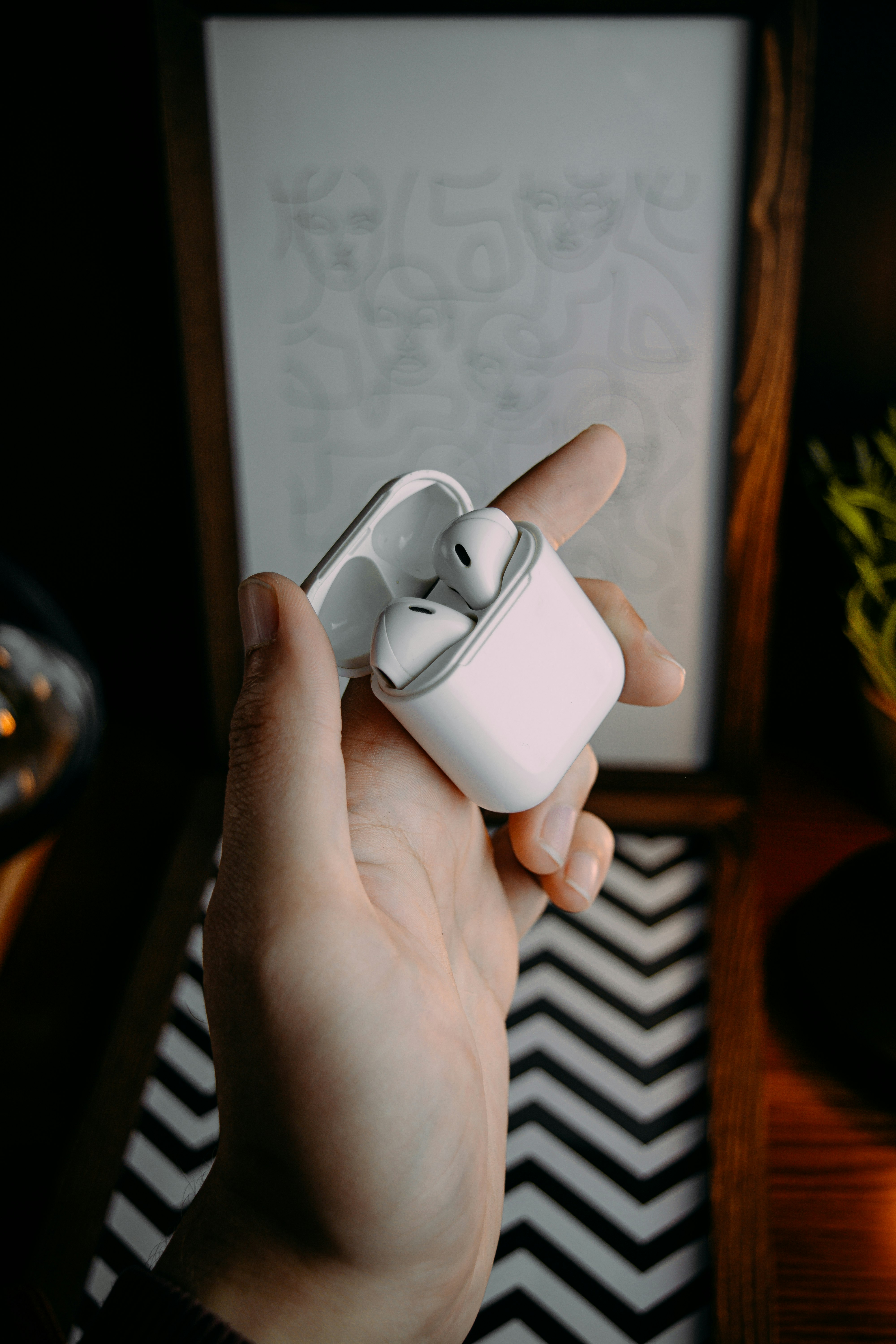 person holding white plastic container